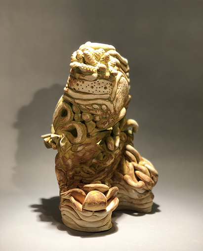 Photo of clay sculpture from 2020 2d3d Polykroma exhibit by jose Hernandez Santillan. Titled Vase of Suculents, 2019.